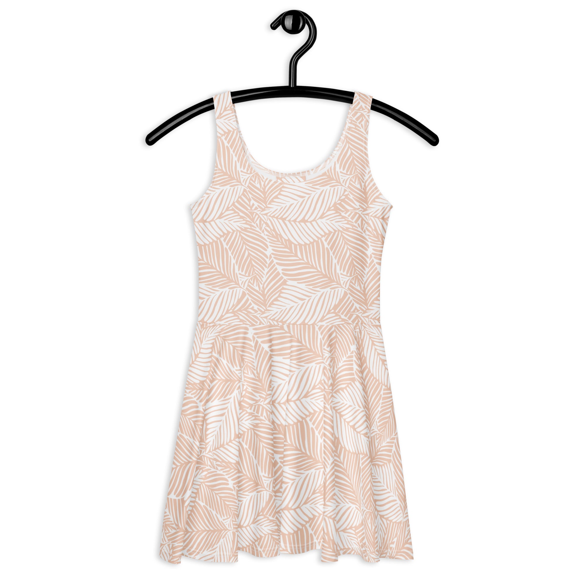 A soft blush neutral sleeveless skater dress with white and beige leaf print made from buttery soft fabric with UPF 50+