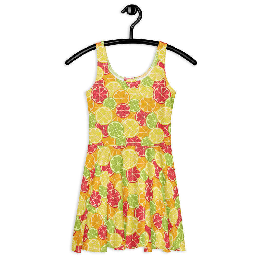 A vibrant yellow women’s buttery soft skater dress with citrus fruit pattern and UPF 50 plus sun protection