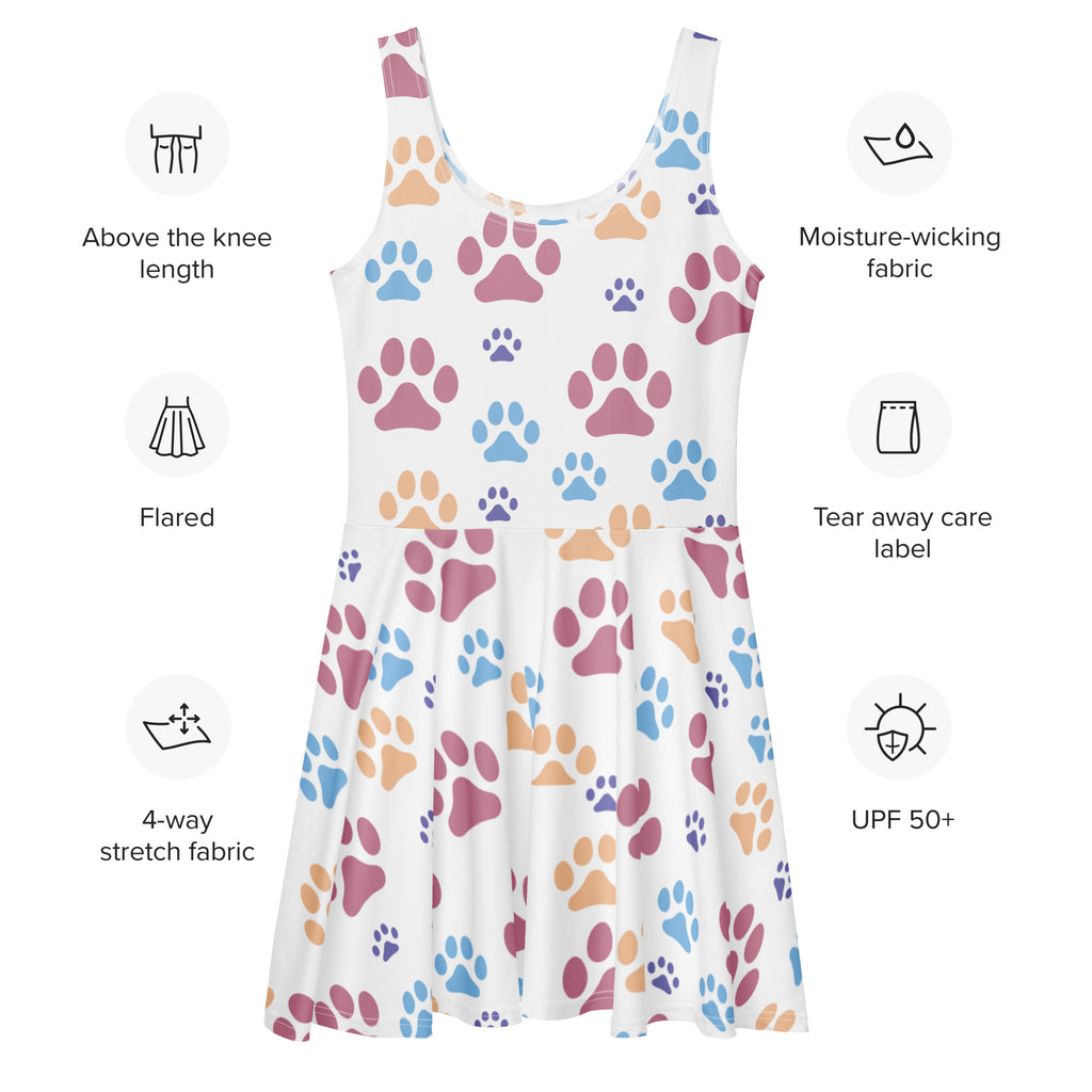 White above the knee skater dress with colorful paw prints in pink blue and orange buttery soft fabric and UPF 50+