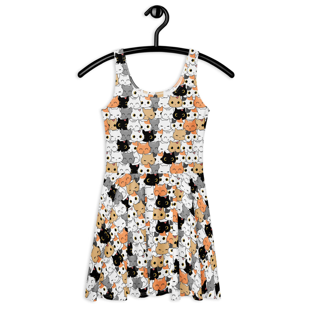 White sleeveless buttery soft skater dress with black gray and orange cartoon cat faces and upf 50 plus protection