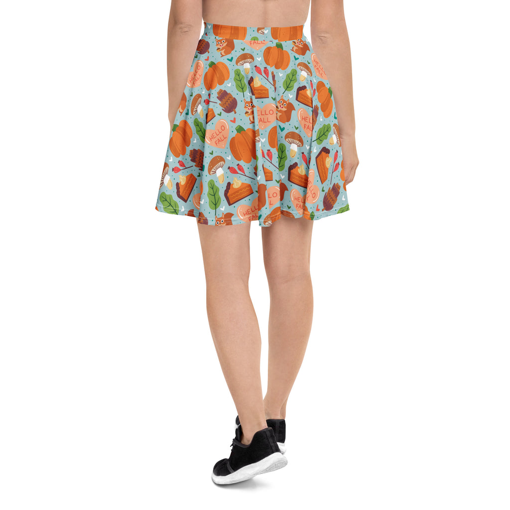Women’s hello fall skater skirt in light blue recycled fabric with autumn pumpkin and pie pattern and upf 50 plus protection