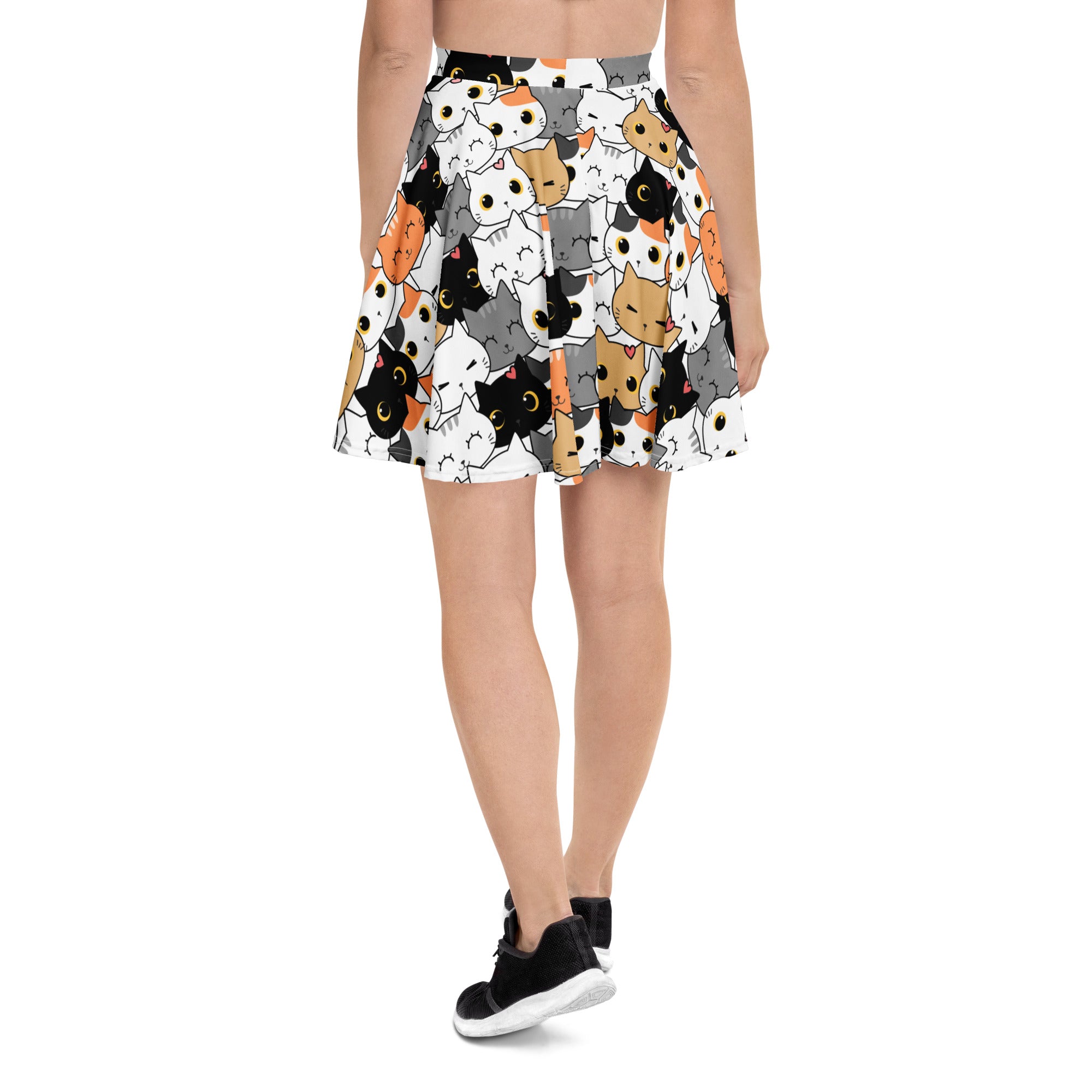 White pleated women’s cat face skater skirt with playful cartoon cats in black orange and gray made from recycled fabric