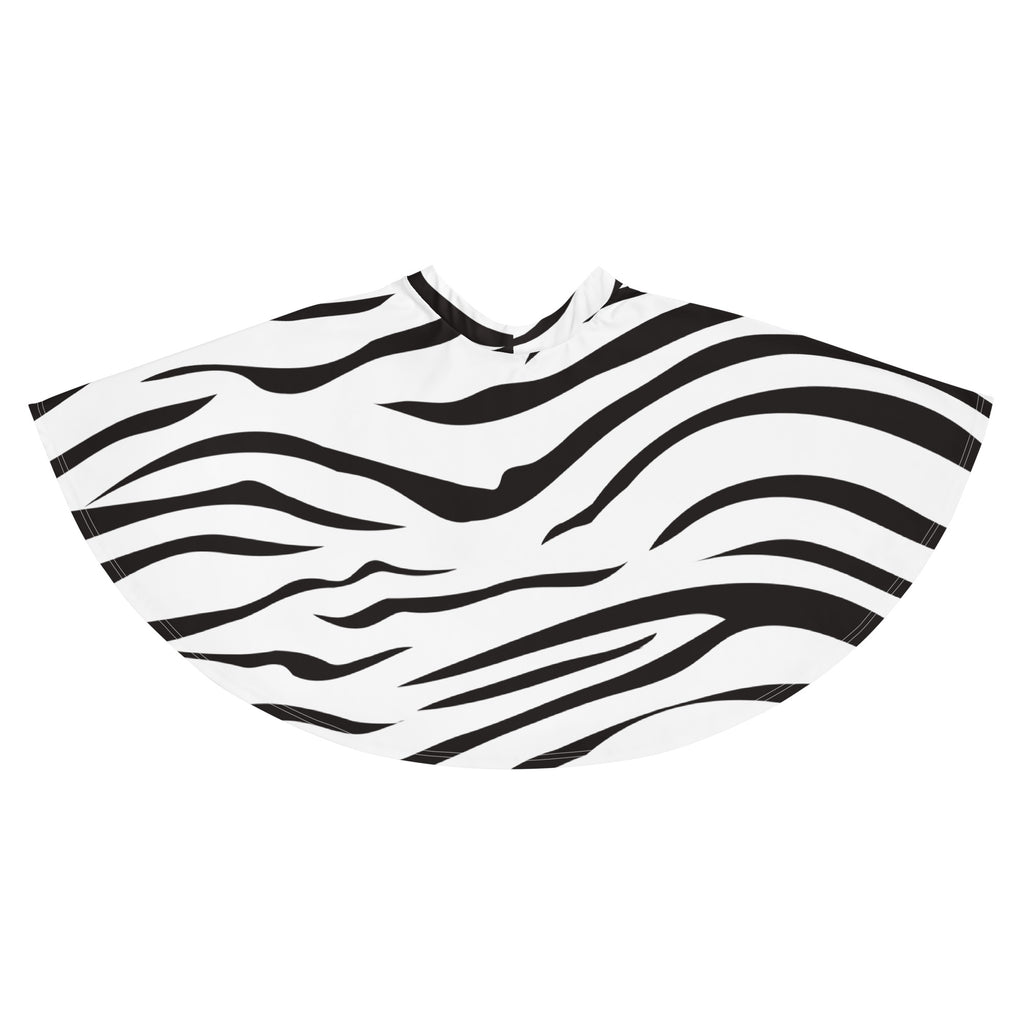 A black and white zebra-striped salon cape made of smooth lightweight fabric paired with a flowy high waisted skater skirt