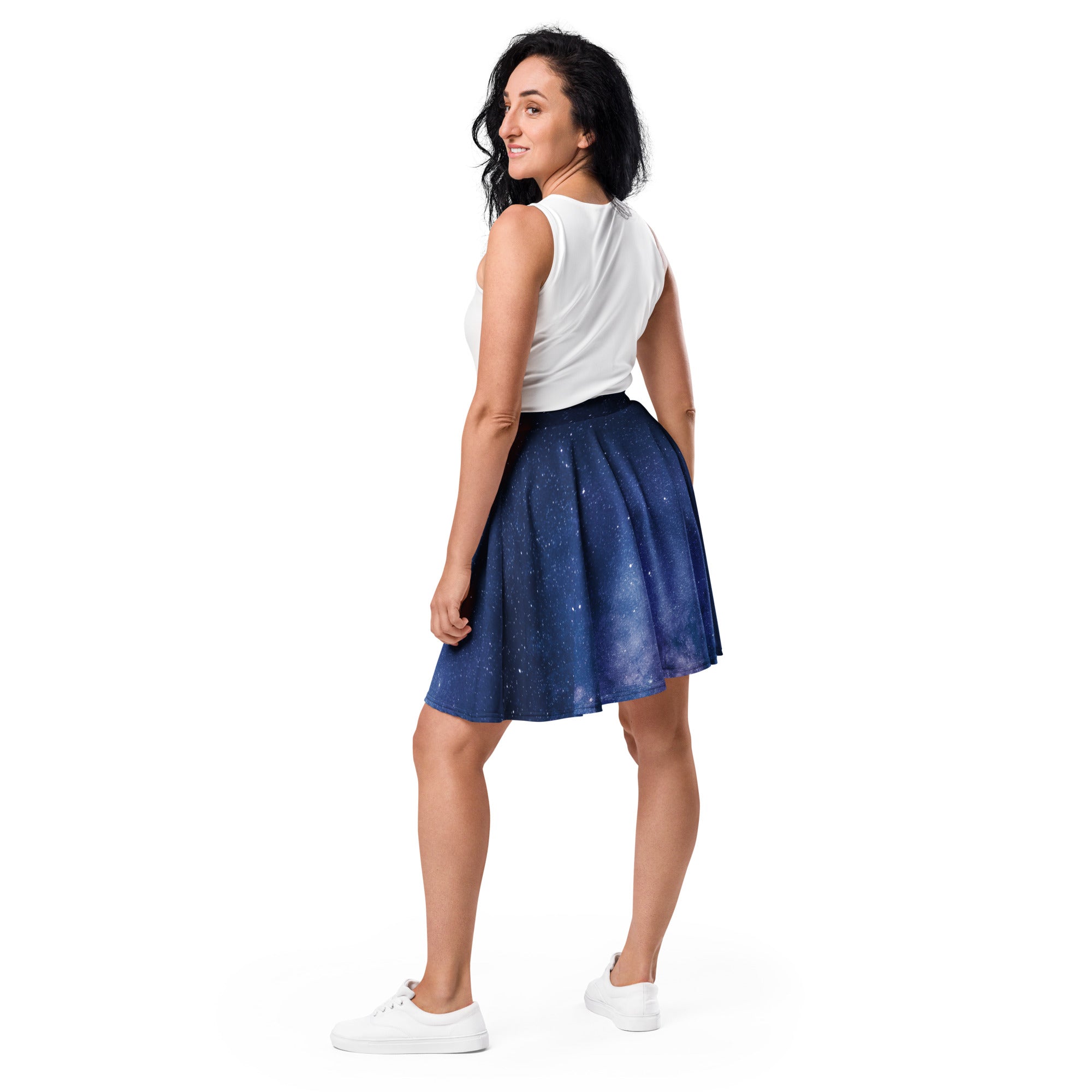 A navy blue pleated skater skirt with realistic starry night sky print made from recycled fabric with UPF 50+ protection