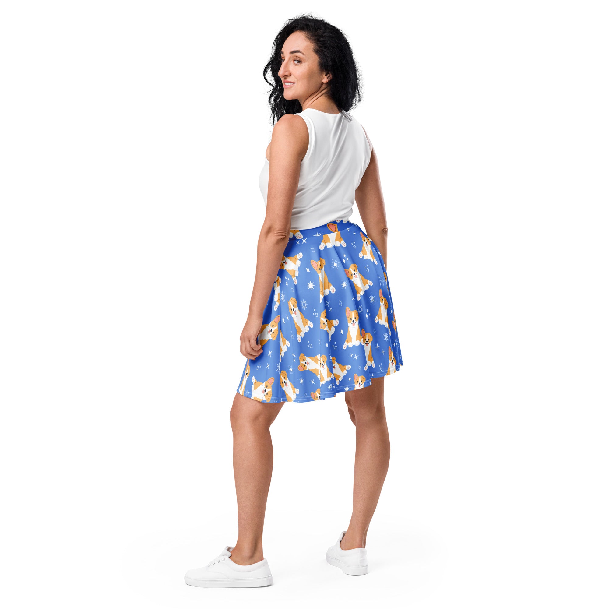 Women’s blue corgi dog skater skirt featuring a playful pattern of corgis and snowflakes made with recycled fabric