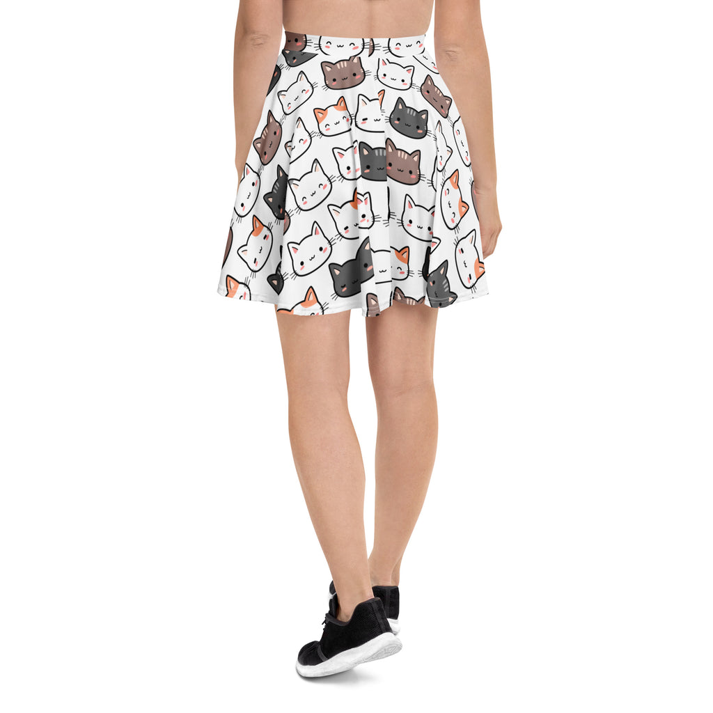 White pleated skater skirt with colorful cartoon cat faces high waisted flowy fabric with upf 50 plus recycled material