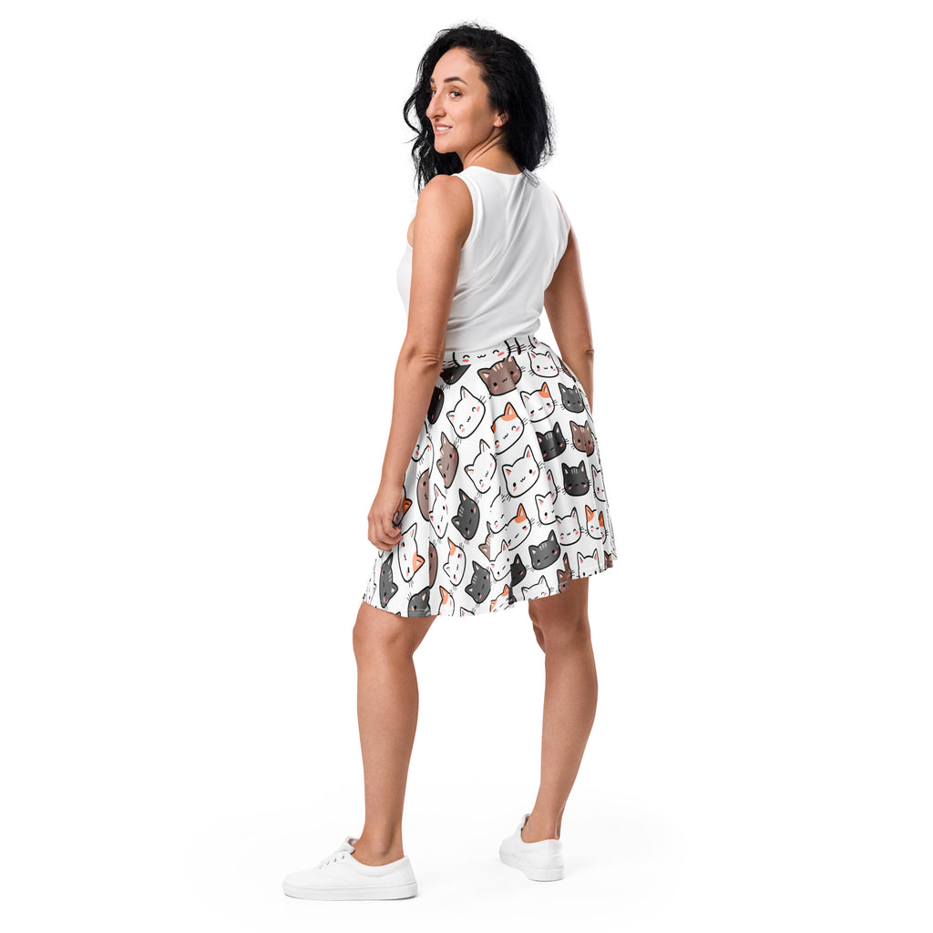 White skater skirt with playful multicolor cartoon cat faces made of recycled fabric with upf 50 plus protection