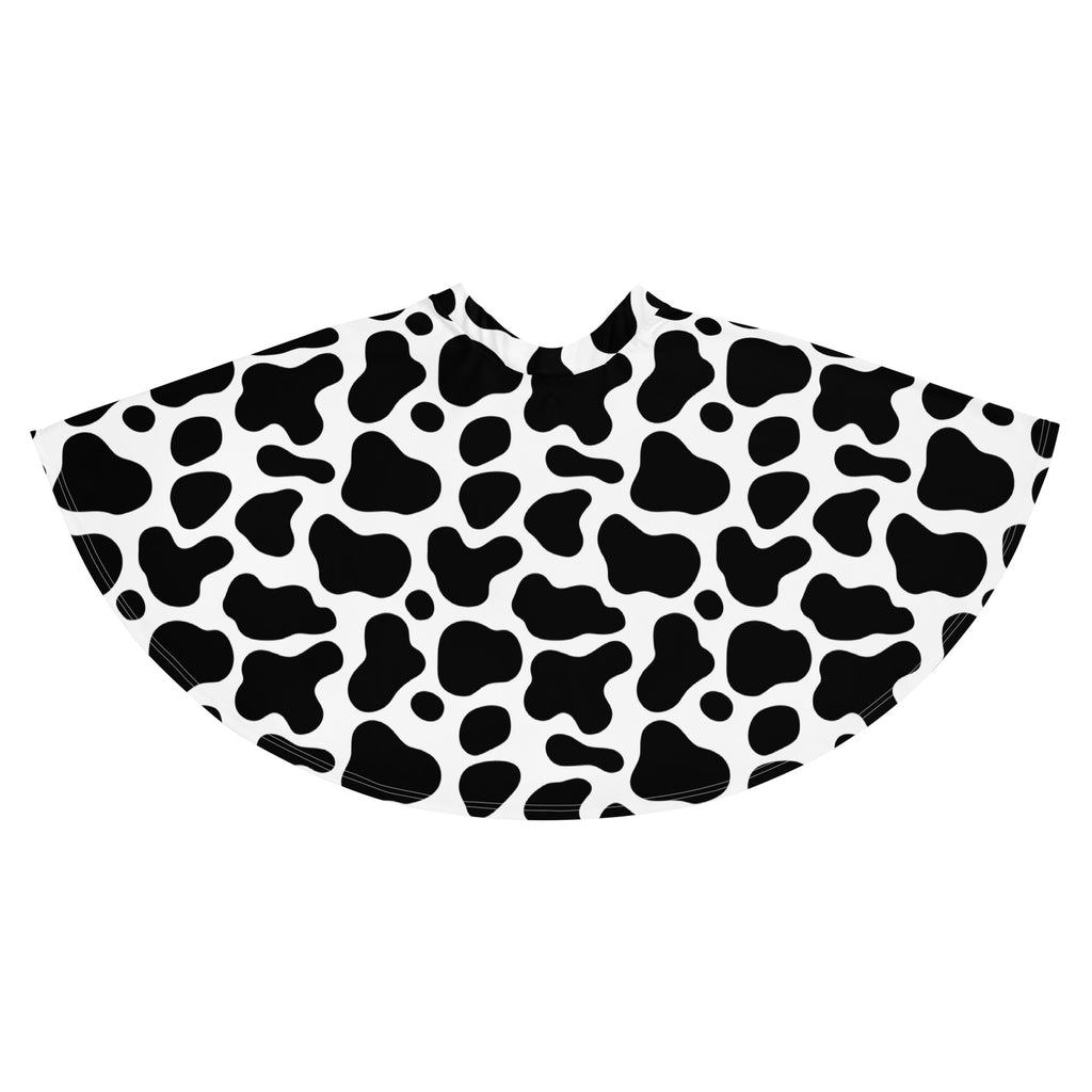 A black and white cow print women’s skater skirt with a flowy high waisted silhouette made from recycled fabric