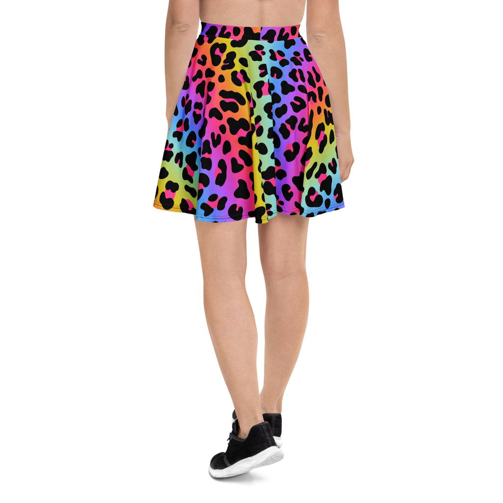 A vibrant rainbow leopard skater skirt with pleats high waisted flowy recycled fabric and upf 50 plus protection