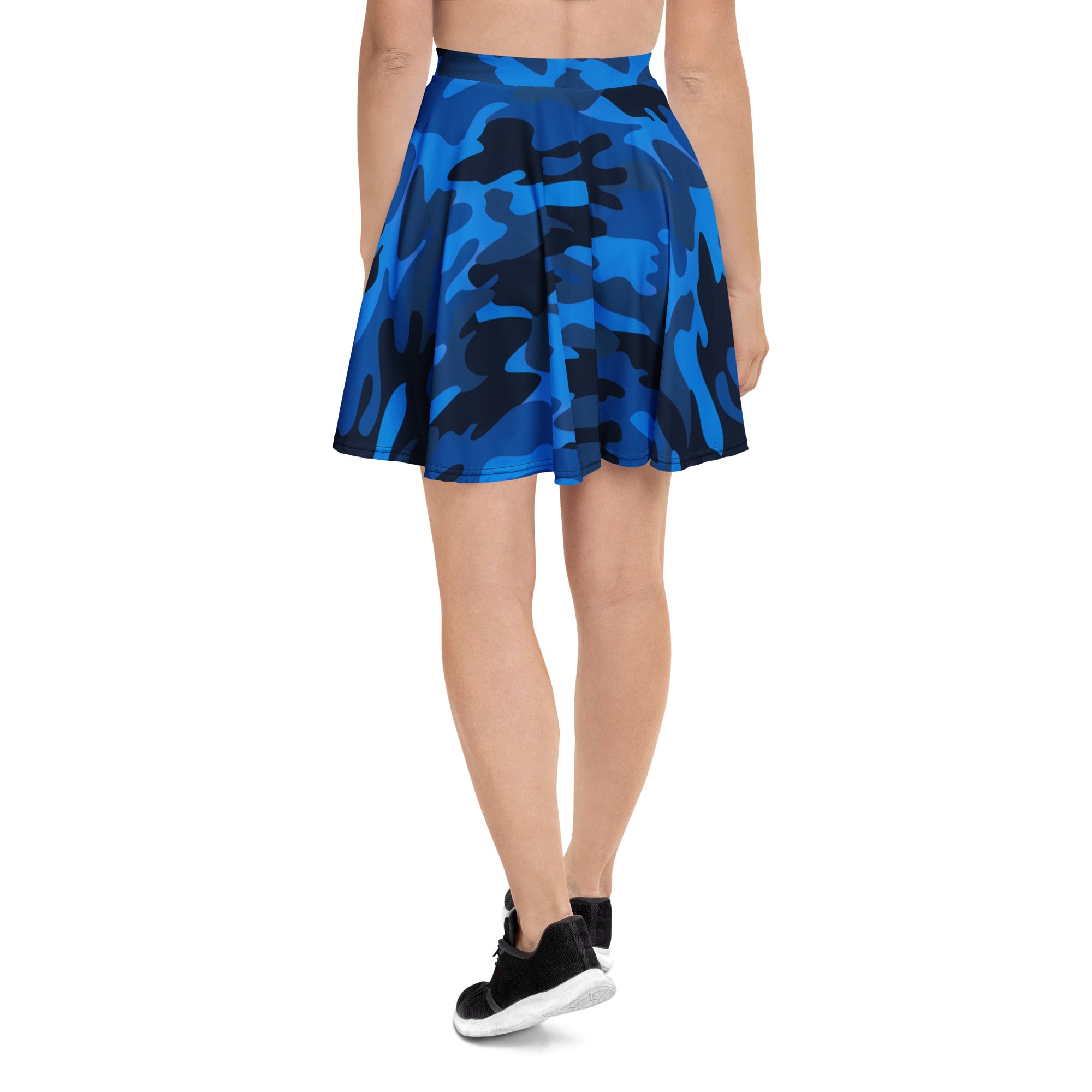 A flared women’s blue and black camouflage skater skirt made from stretchy recycled fabric with high waisted design and UPF 50+ protection