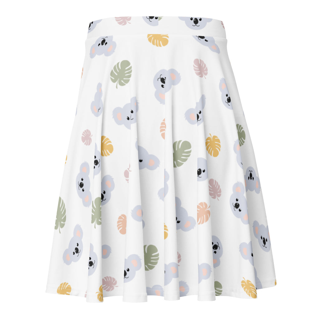 White pleated skater skirt with gray koala and tropical leaf print in soft green yellow and pink made from recycled fabric with upf 50+