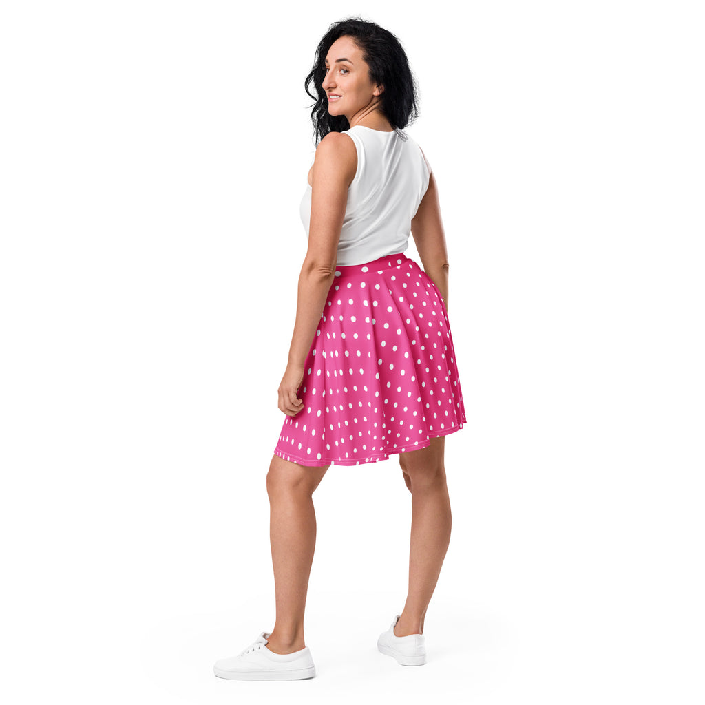 A vibrant pink women’s polka dot skater skirt with flowy lightweight fabric high waisted with UPF 50+ and recycled fabric