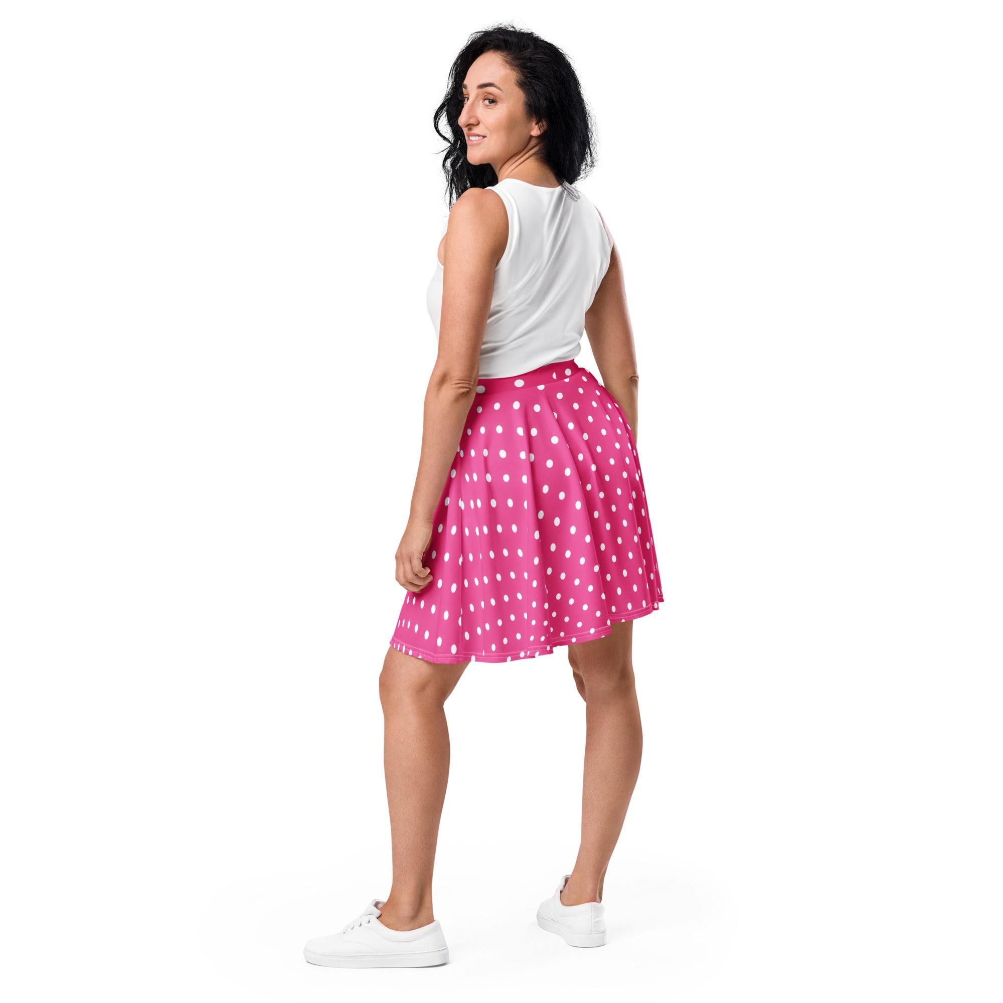 A vibrant pink women’s polka dot skater skirt with flowy lightweight fabric high waisted with UPF 50+ and recycled fabric