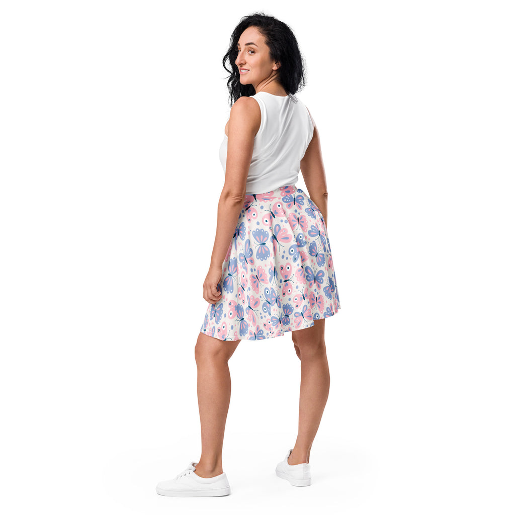 Women’s butterfly print skater skirt with pink and blue butterflies on white lightweight recycled fabric with upf 50+