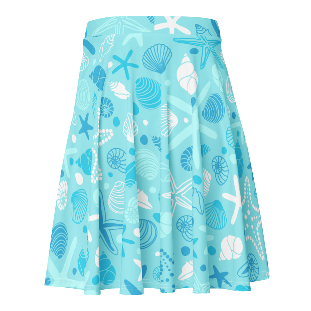 Women’s starfish and shells skater skirt in light blue pleated recycled fabric with upf 50+ and sea creature print