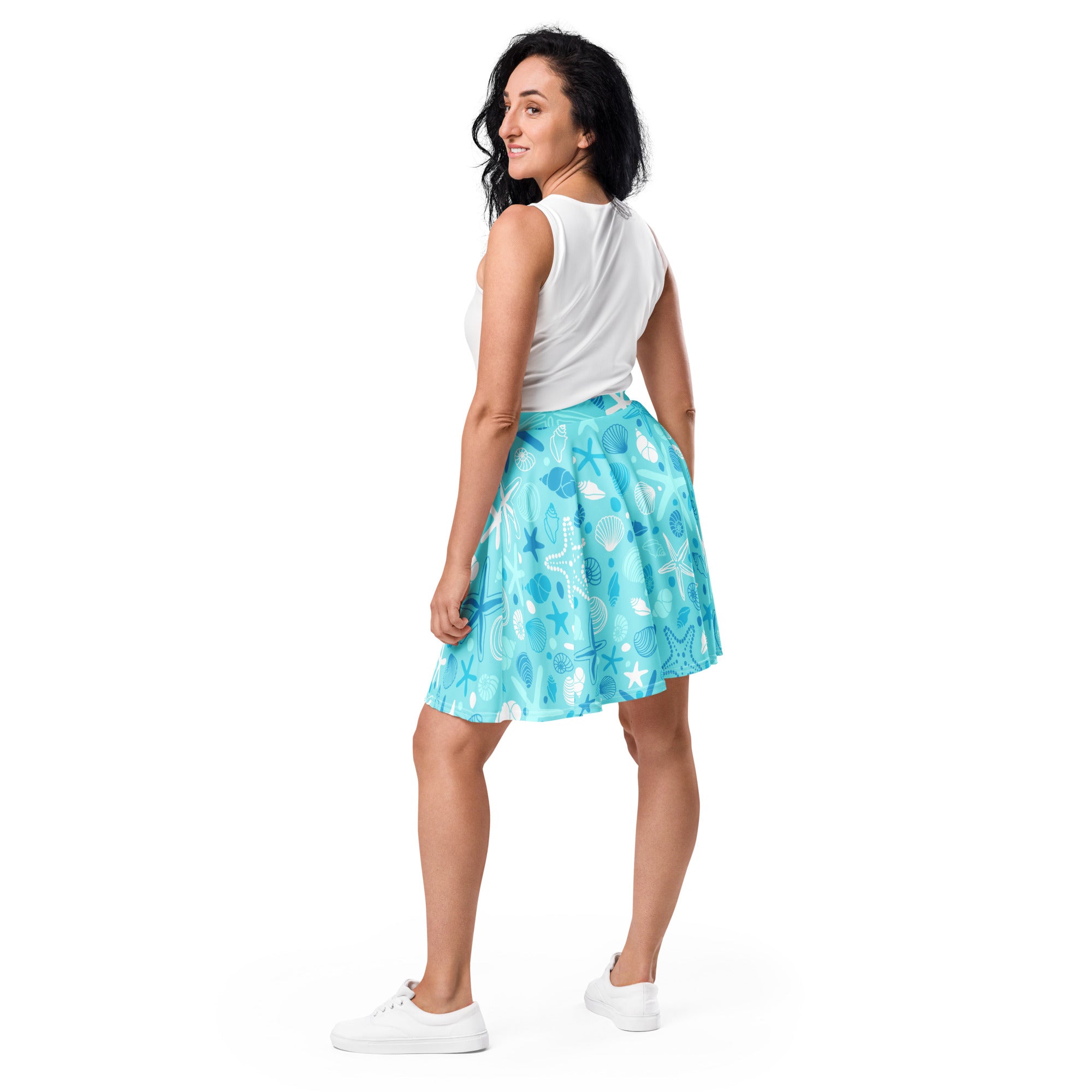 A light blue women’s starfish and shells skater skirt with a flowy high waist made from recycled fabric with upf 50+