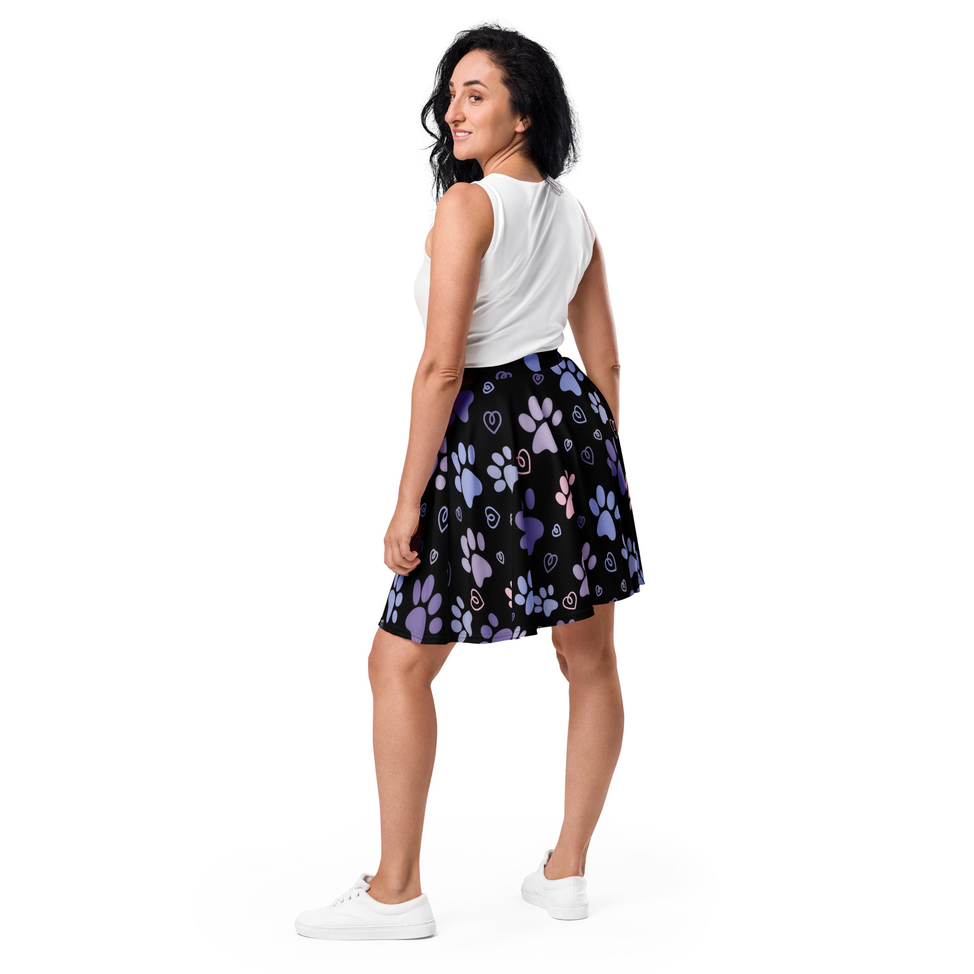 Women’s black pleated skater skirt with purple and light blue paw prints and hearts made from recycled fabric with upf 50+