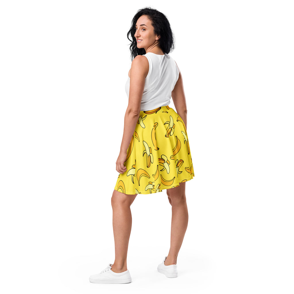 Women’s yellow banana skater skirt with playful pattern flowy high waisted made from recycled fabric with upf 50+ protection