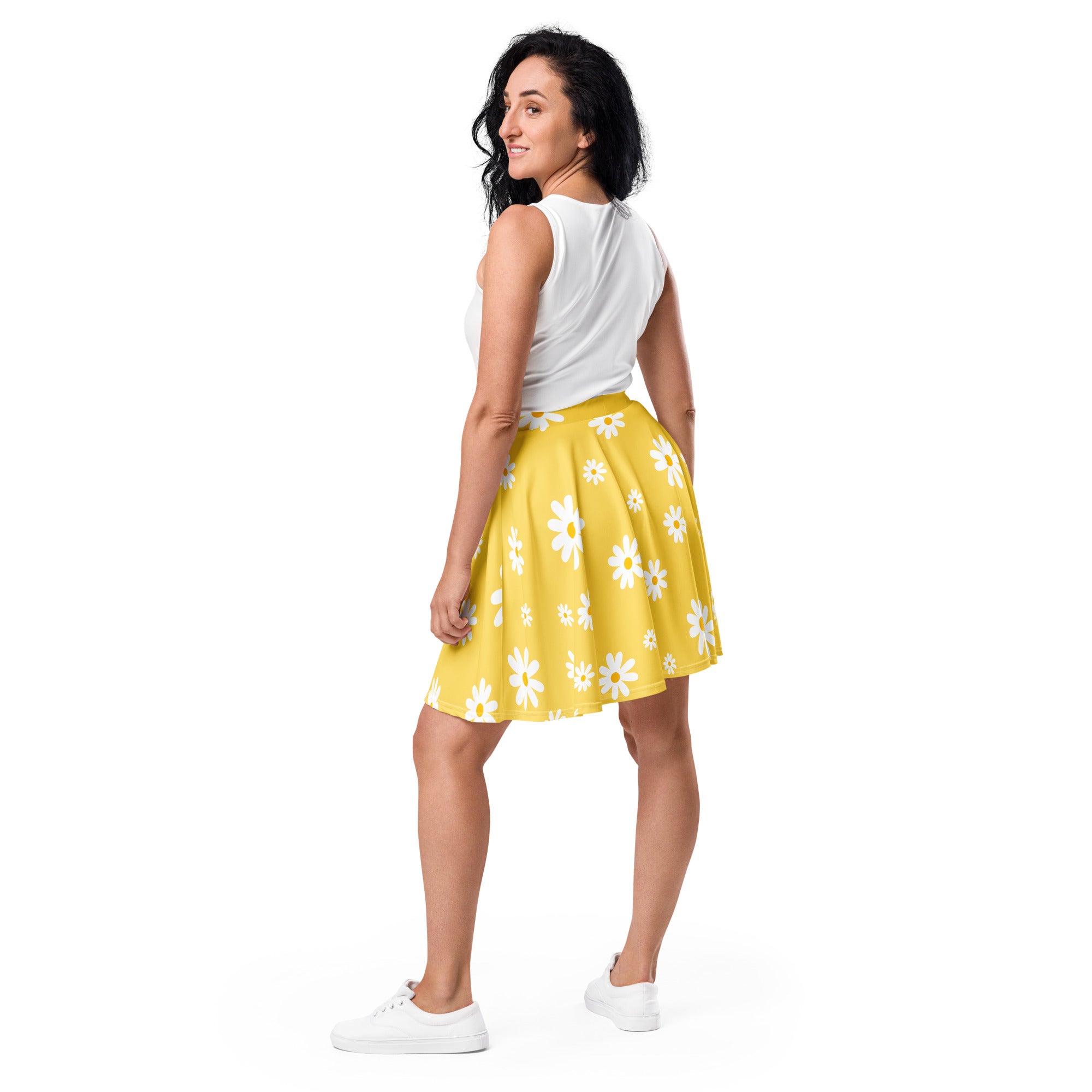 A vibrant yellow pleated skater skirt with white daisies made from recycled fabric and UPF 50 plus protection