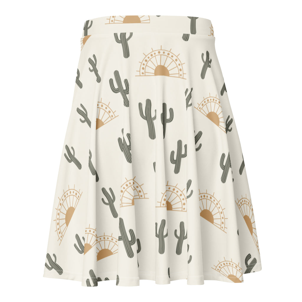 Women’s desert cactus sunrise skater skirt in off-white recycled fabric with gray cacti and tan sunburst pattern and UPF 50+