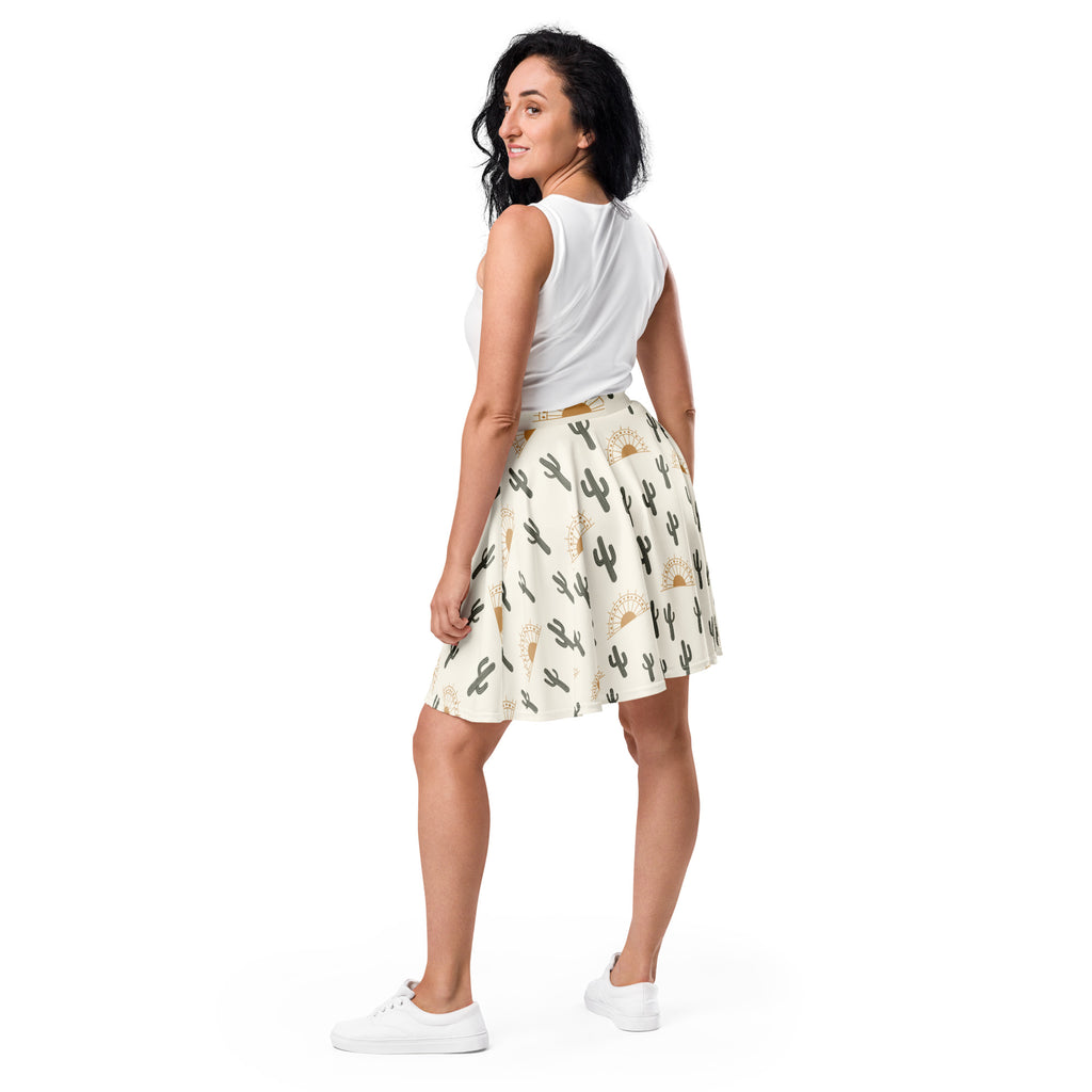 Women’s desert cactus sunrise skater skirt with cream base black cactus and gold sun motifs flowy high waisted recycled fabric