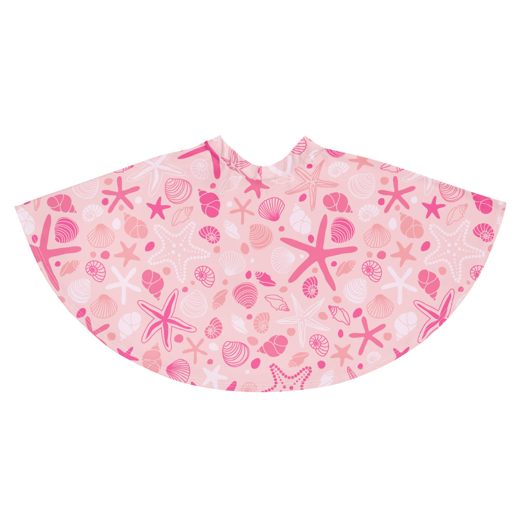 Women’s pink starfish and seashell patterned beach poncho made from recycled fabric with upf 50 plus protection