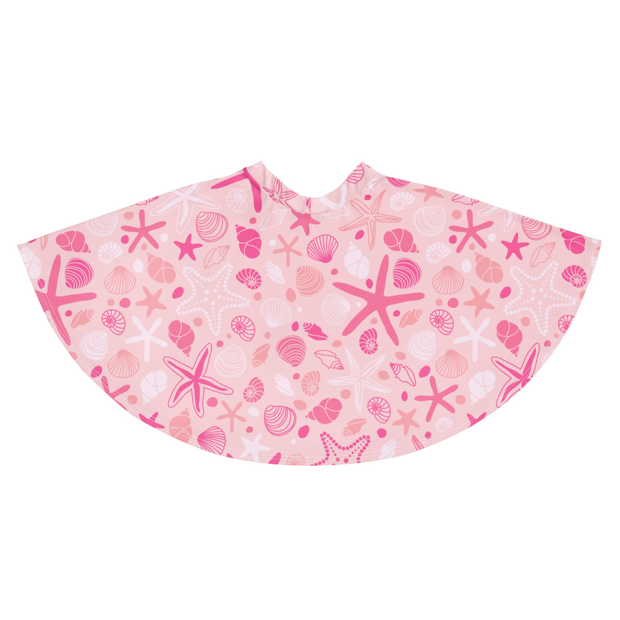 Women’s pink starfish and seashell patterned beach poncho made from recycled fabric with upf 50 plus protection