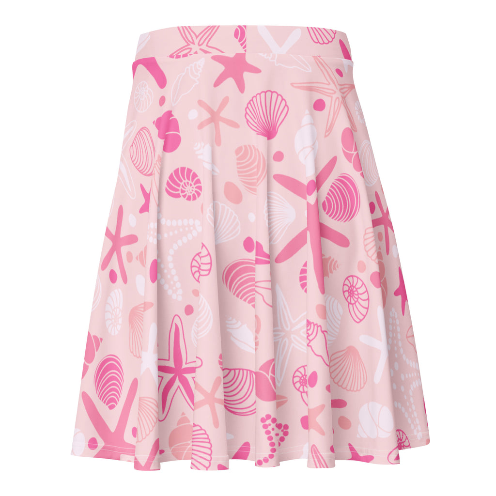 Women’s pink starfish and shells pleated skater skirt with playful pattern, flowy high waisted fabric with UPF 50+