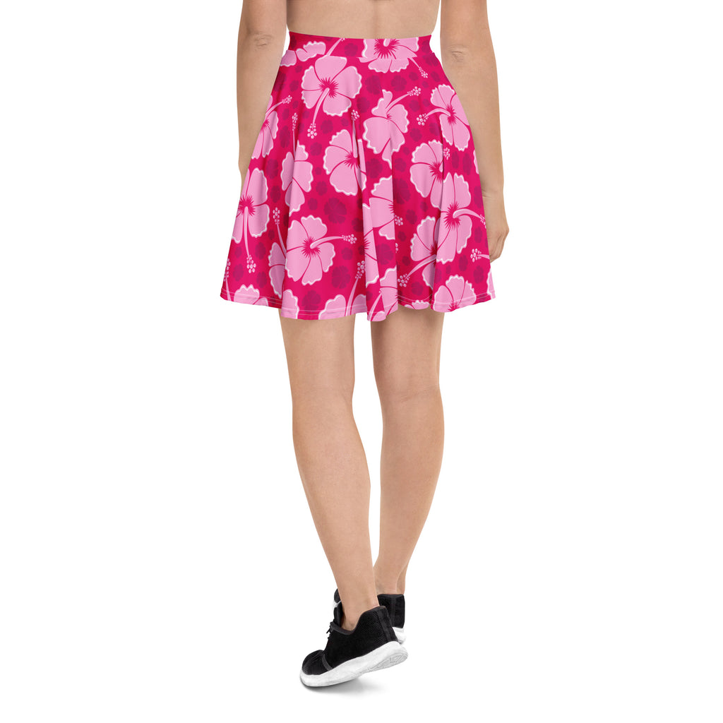 A vibrant pink high waisted skater skirt with pleats and lighter pink hibiscus floral pattern made from recycled fabric