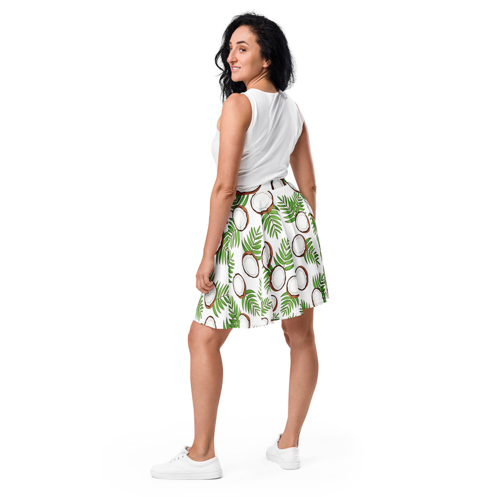 White women’s coconut palm skater skirt with vibrant green palm leaves brown and white coconuts flowy high waisted fabric