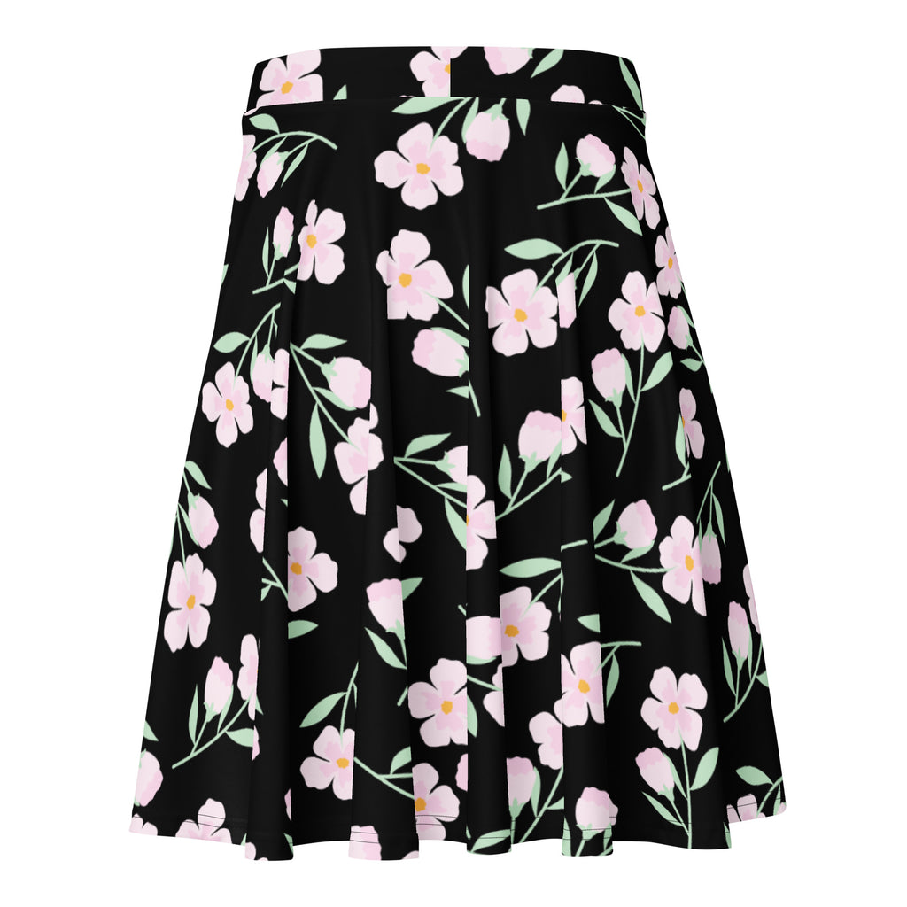 Women’s black floral skater skirt with pink flowers yellow centers light green stems flowy high waisted upf 50 recycled fabric