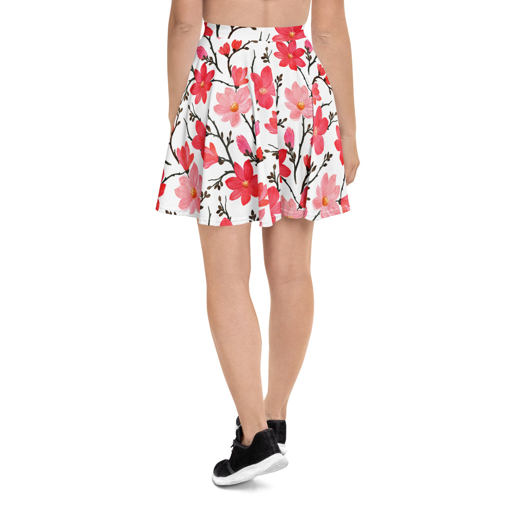 Women’s pink watercolor floral skater skirt with vibrant pink and red flowers on white flared fabric with upf 50 plus