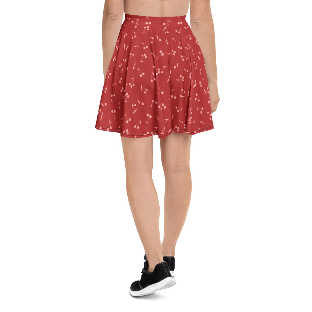 A red cherry-print pleated skater skirt for women made with recycled fabric featuring flowy high waisted design and upf 50+