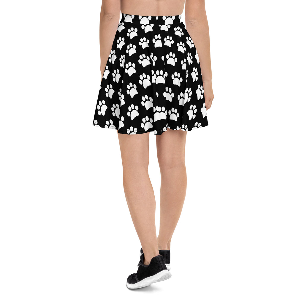 Women’s black pleated skater skirt with white paw print pattern flowy high waisted upf 50 plus recycled fabric