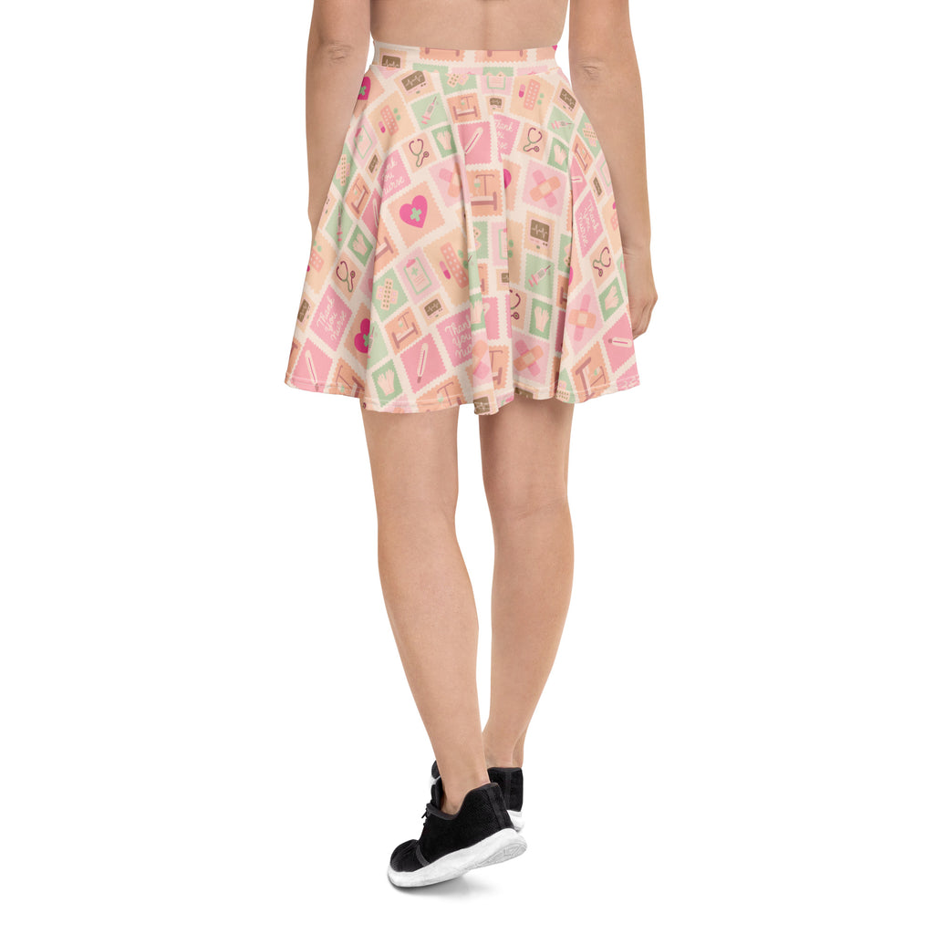 Women’s pink nurse icon skater skirt with flared pastel pink and mint medical pattern made from recycled fabric with upf 50+
