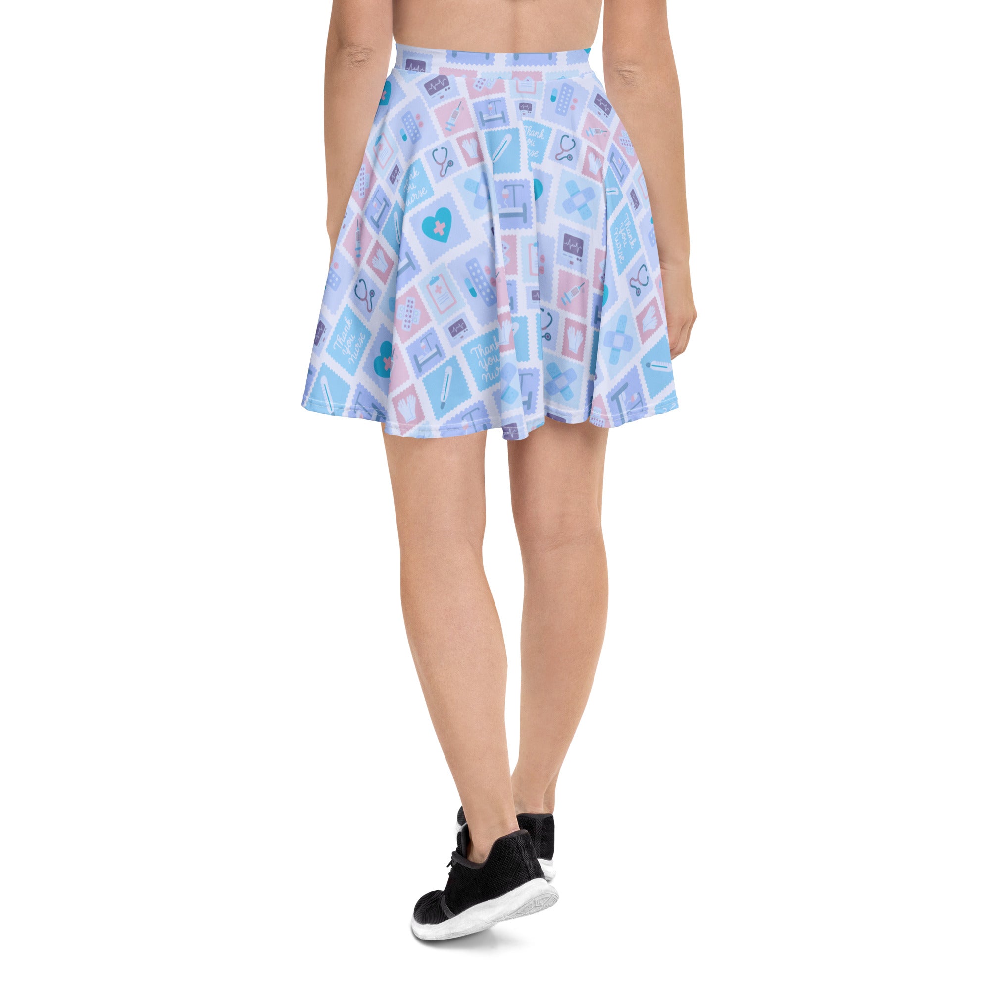 Women’s blue nurse icon skater skirt in pastel blue and pink with medical print made from recycled fabric with UPF 50+