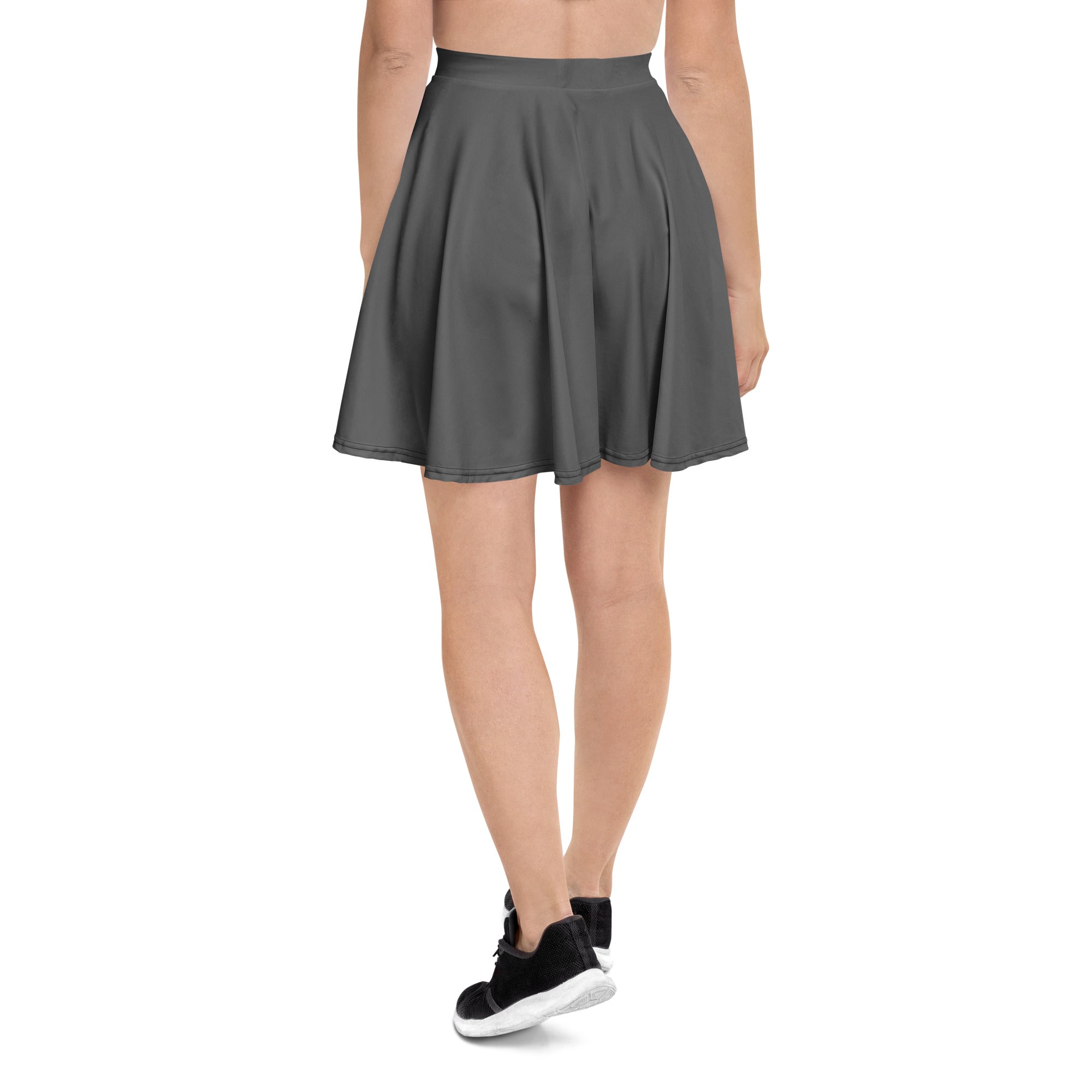 A flared dark gray pleated skater skirt with a high waistband made from recycled fabric and UPF 50 plus protection