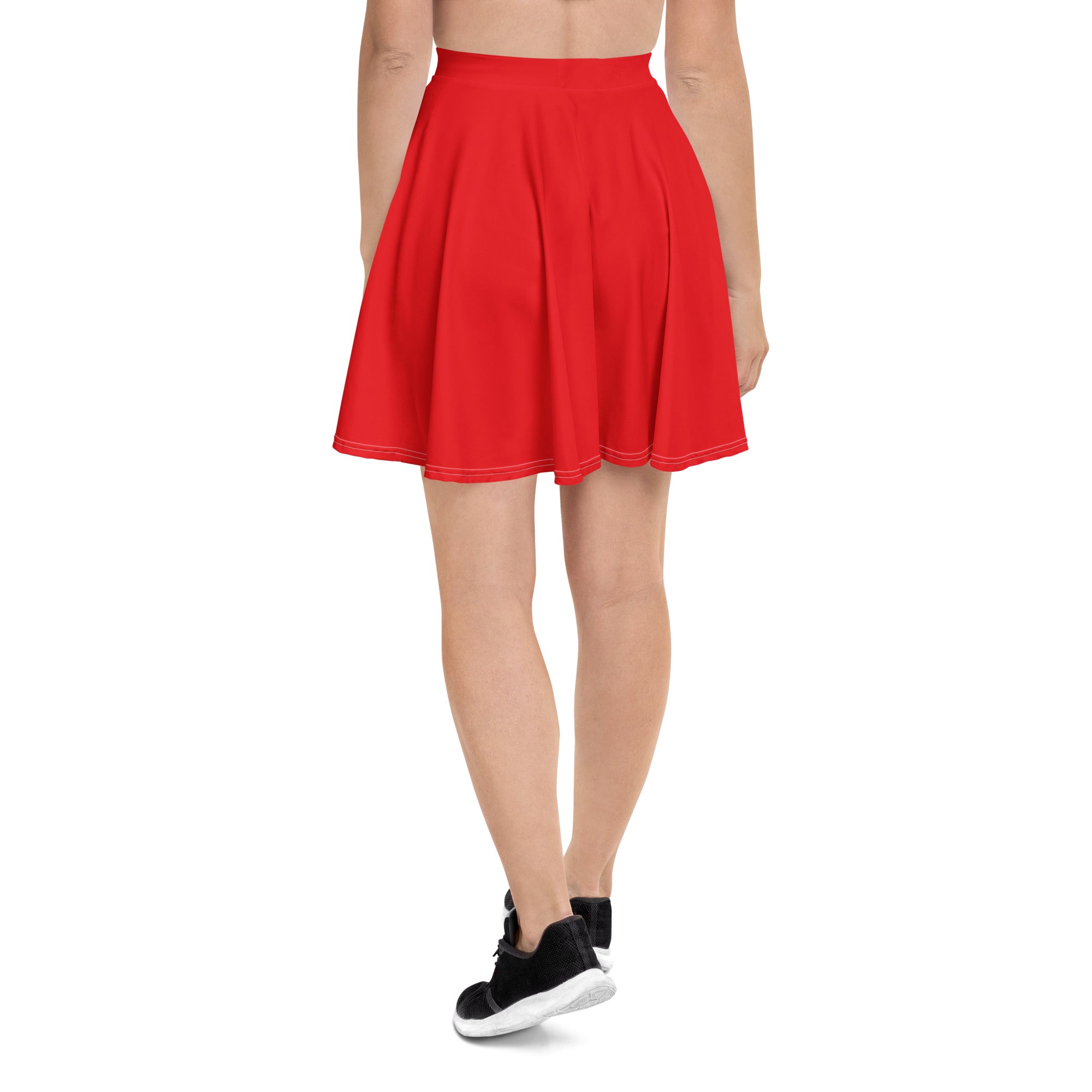 A vibrant red high waisted pleated skater skirt with a flared silhouette and matching stitched hem made from recycled fabric