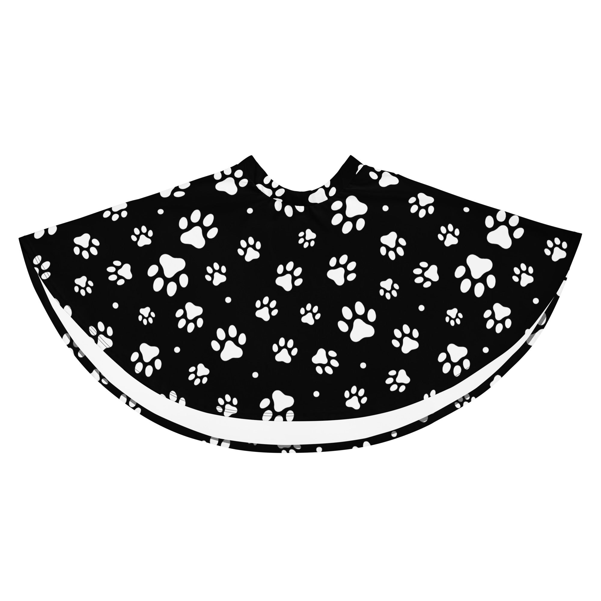 Black pet grooming cape with white paw print pattern and white trim designed as a women’s paw print skater skirt with upf 50 and recycled fabric