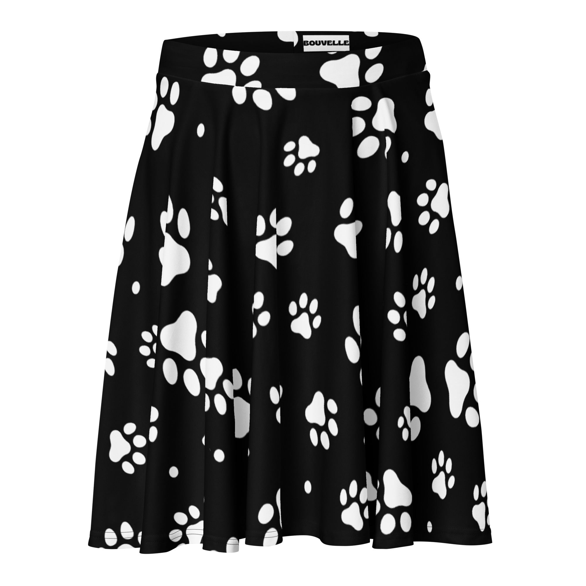 Women’s black pleated skater skirt with white paw print pattern flowy high waisted made from recycled fabric with upf 50+
