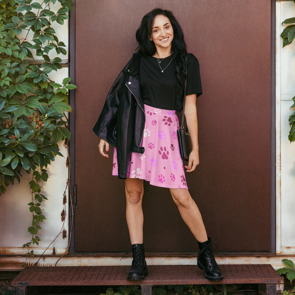 Women’s pink paw print skater skirt with purple and white paw pattern flowy high waisted upf 50 plus recycled fabric