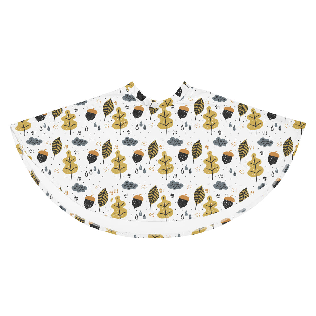A white rain poncho with a playful gold and black autumn leaves pattern perfect for seasonal outdoor use