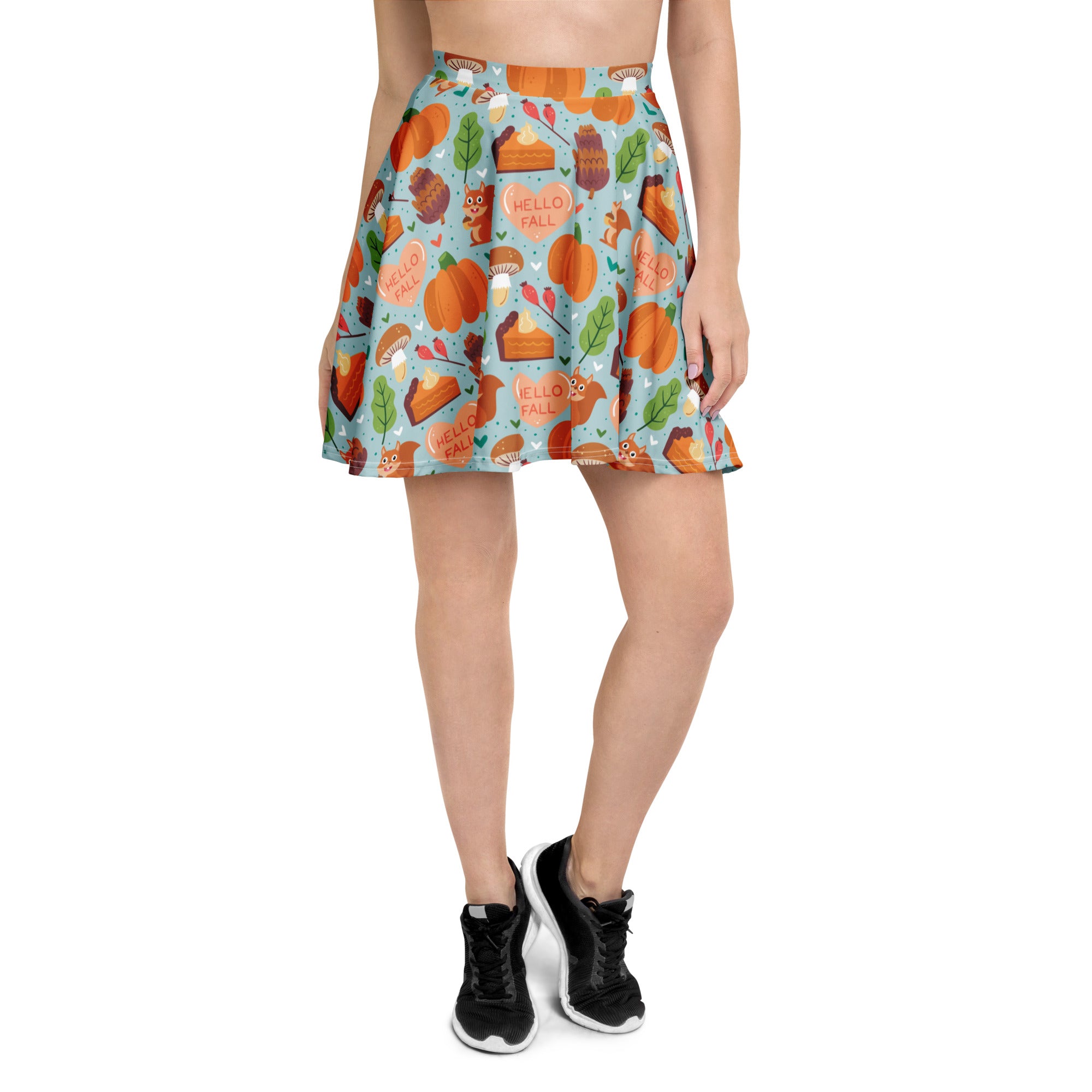 Women’s hello fall skater skirt in light blue with playful autumn pumpkin and pie pattern made from recycled fabric with upf 50+