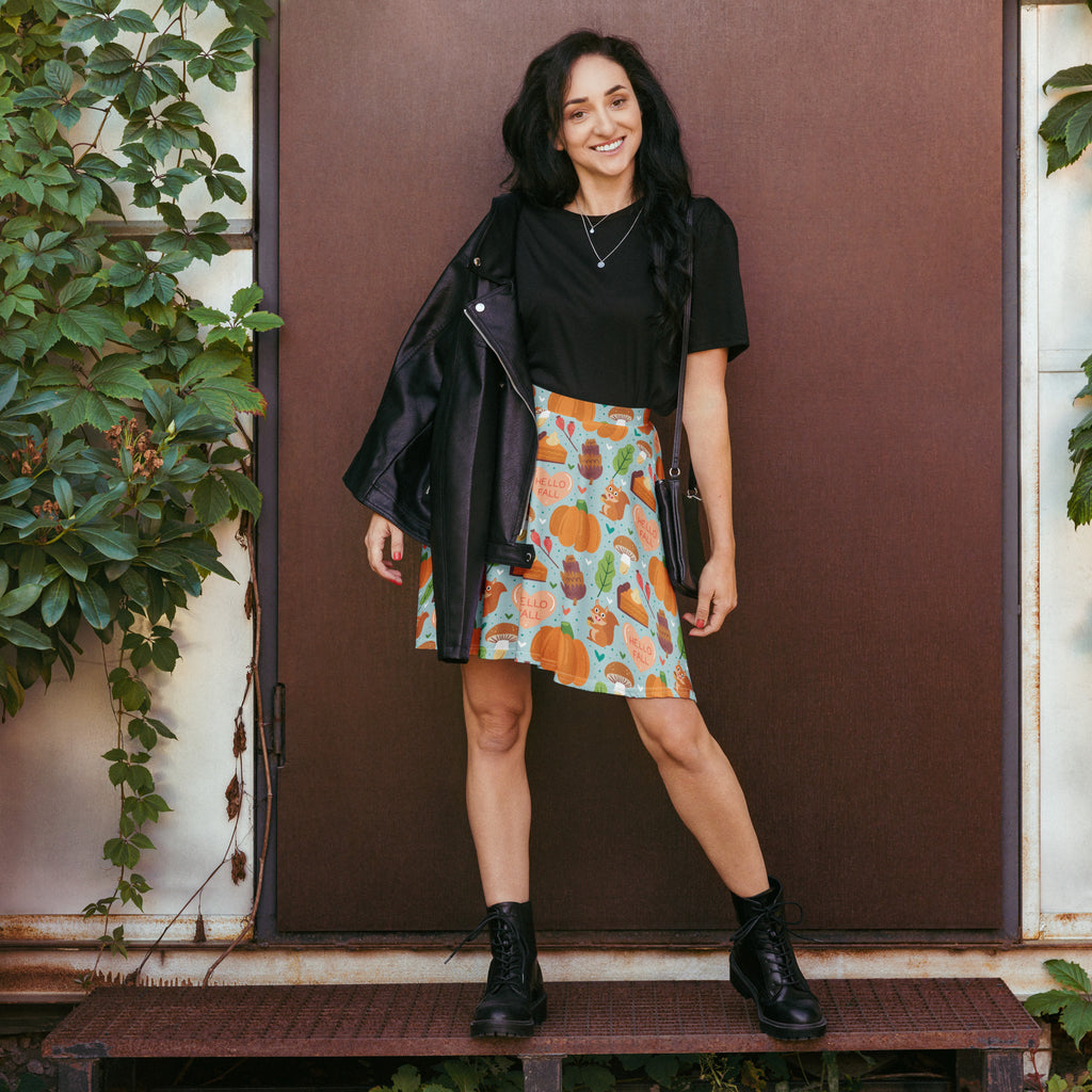 A black leather jacket with zipper closure and silver hardware paired with a women’s hello fall skater skirt