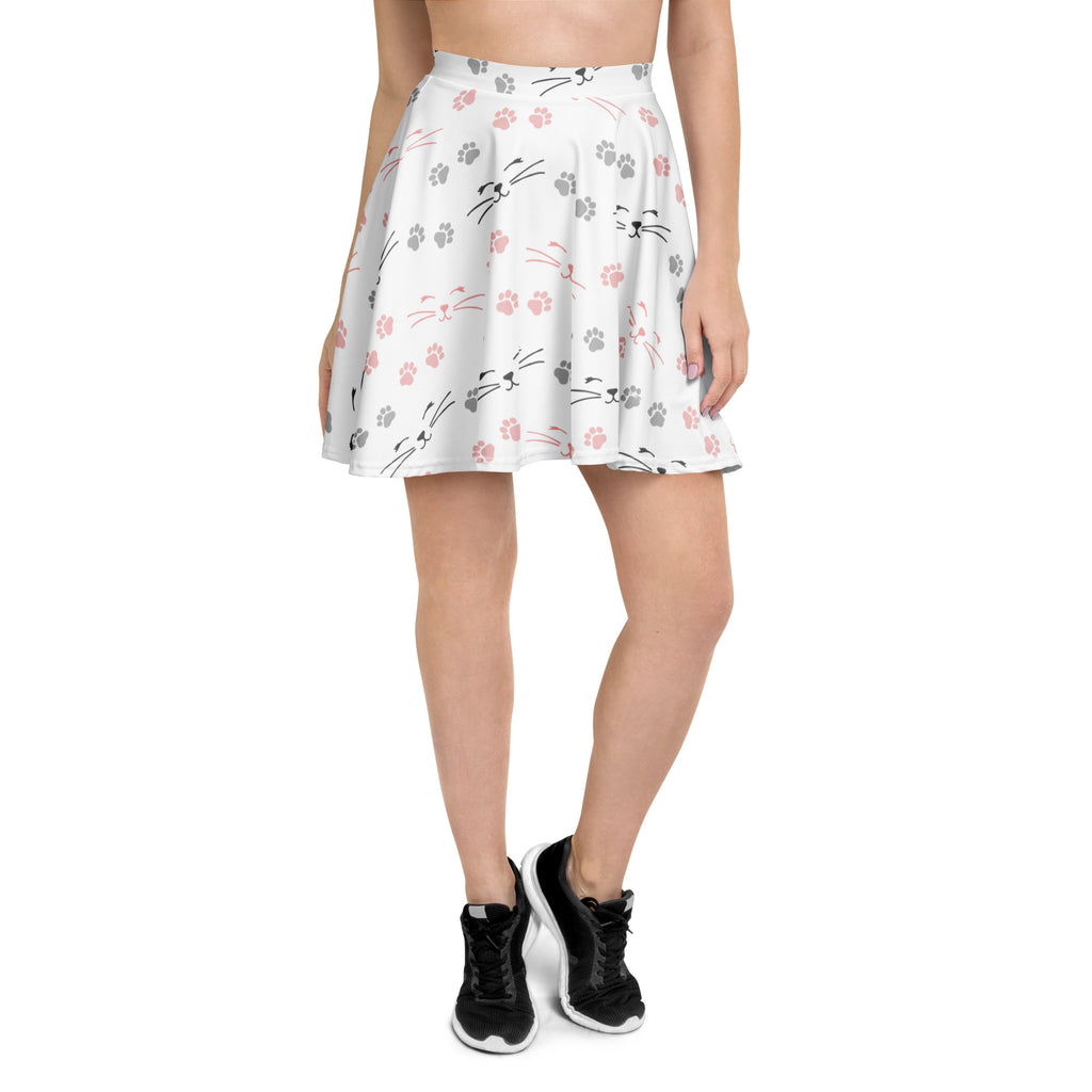 White pleated skater skirt with pink and gray cat whisker and paw print pattern made from recycled fabric with upf 50+