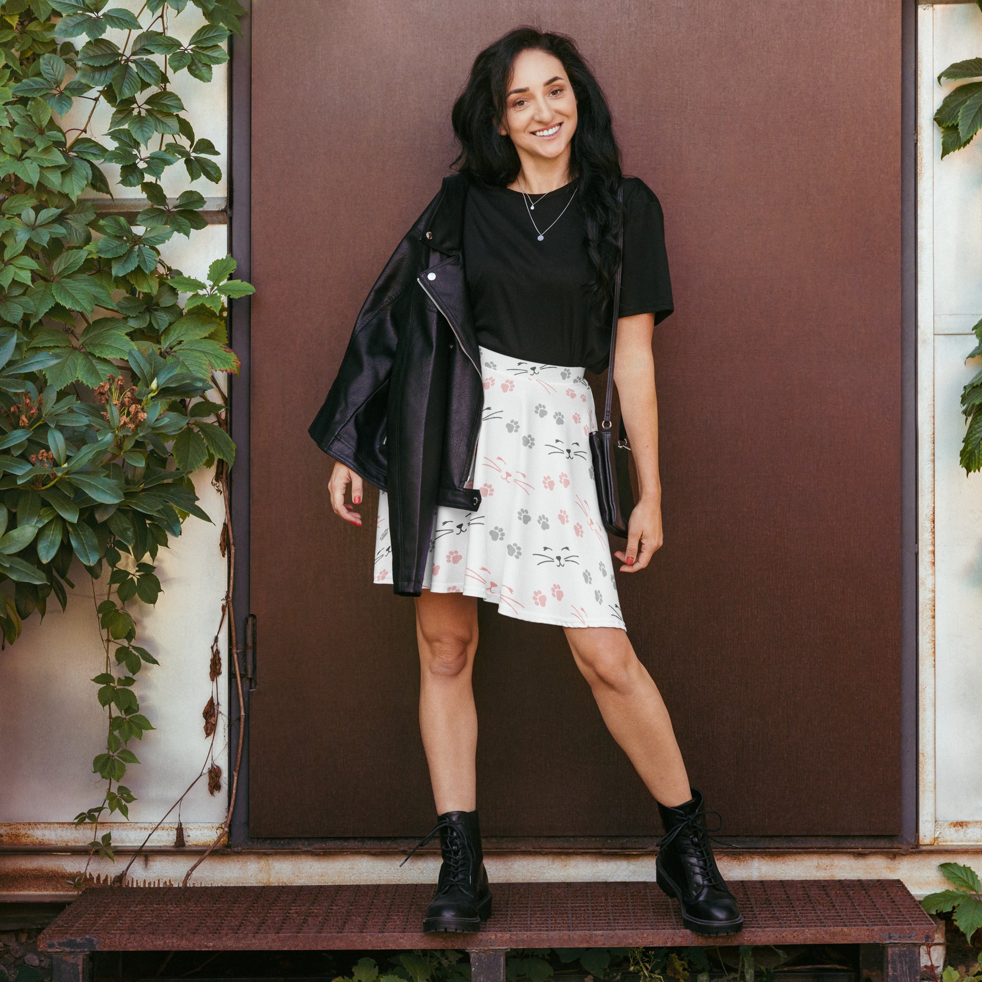 White skater skirt with playful pink and gray cat face pattern high waisted flowy fabric with upf 50 and recycled material