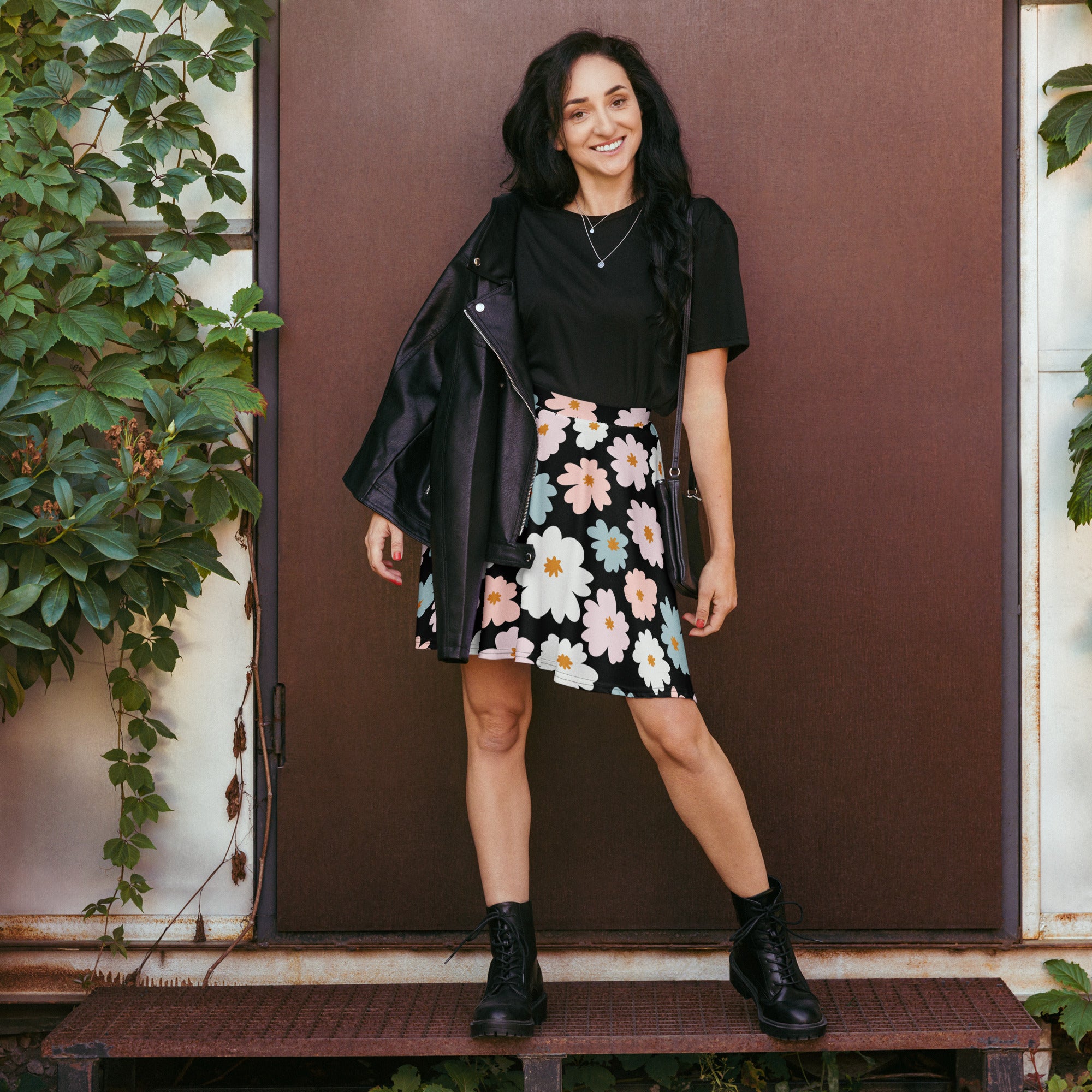 Women’s retro floral skater skirt with pink white and light blue flowers on black recycled fabric with upf 50+