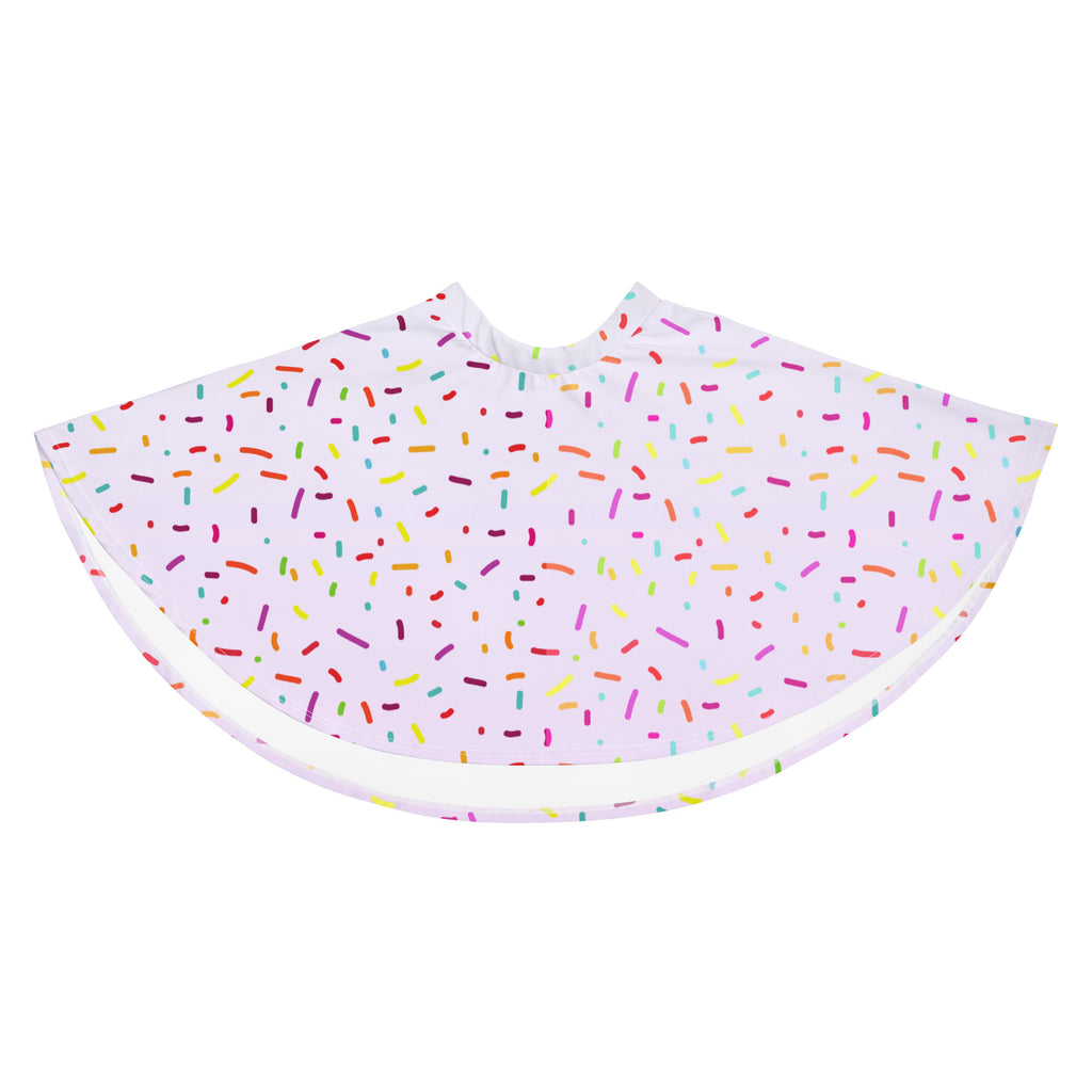 A white barber cape with a playful multicolored sprinkle pattern in rainbow hues made from recycled fabric