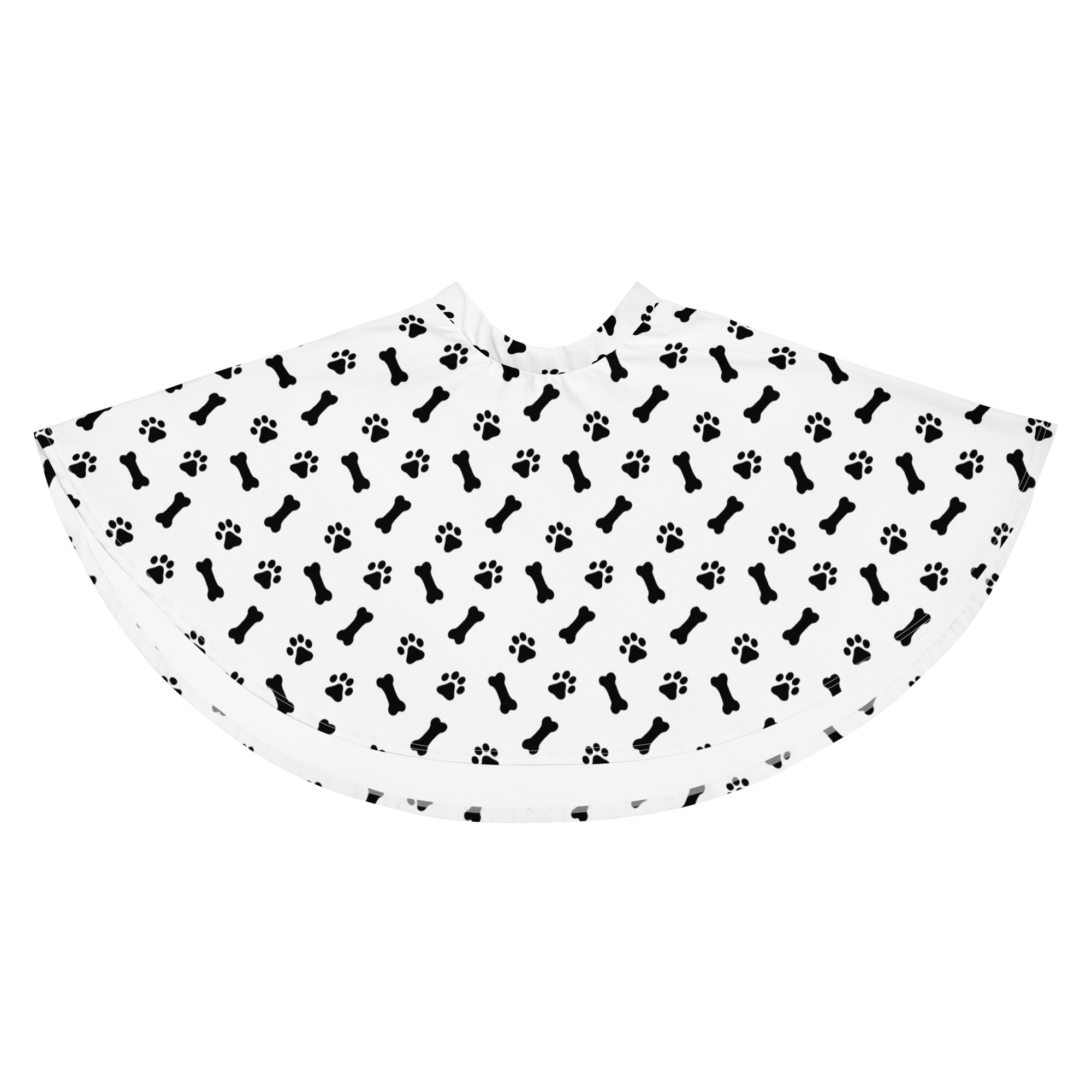 White pet grooming cape with black bone and paw print pattern made from recycled fabric with upf 50+ protection