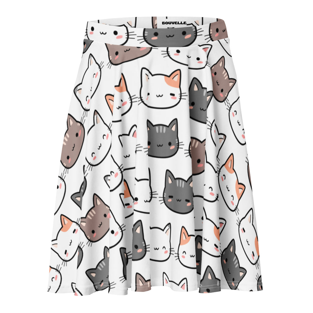 White pleated women’s skater skirt with playful cartoon cat faces in gray brown and orange with pink cheeks, recycled fabric and upf 50+